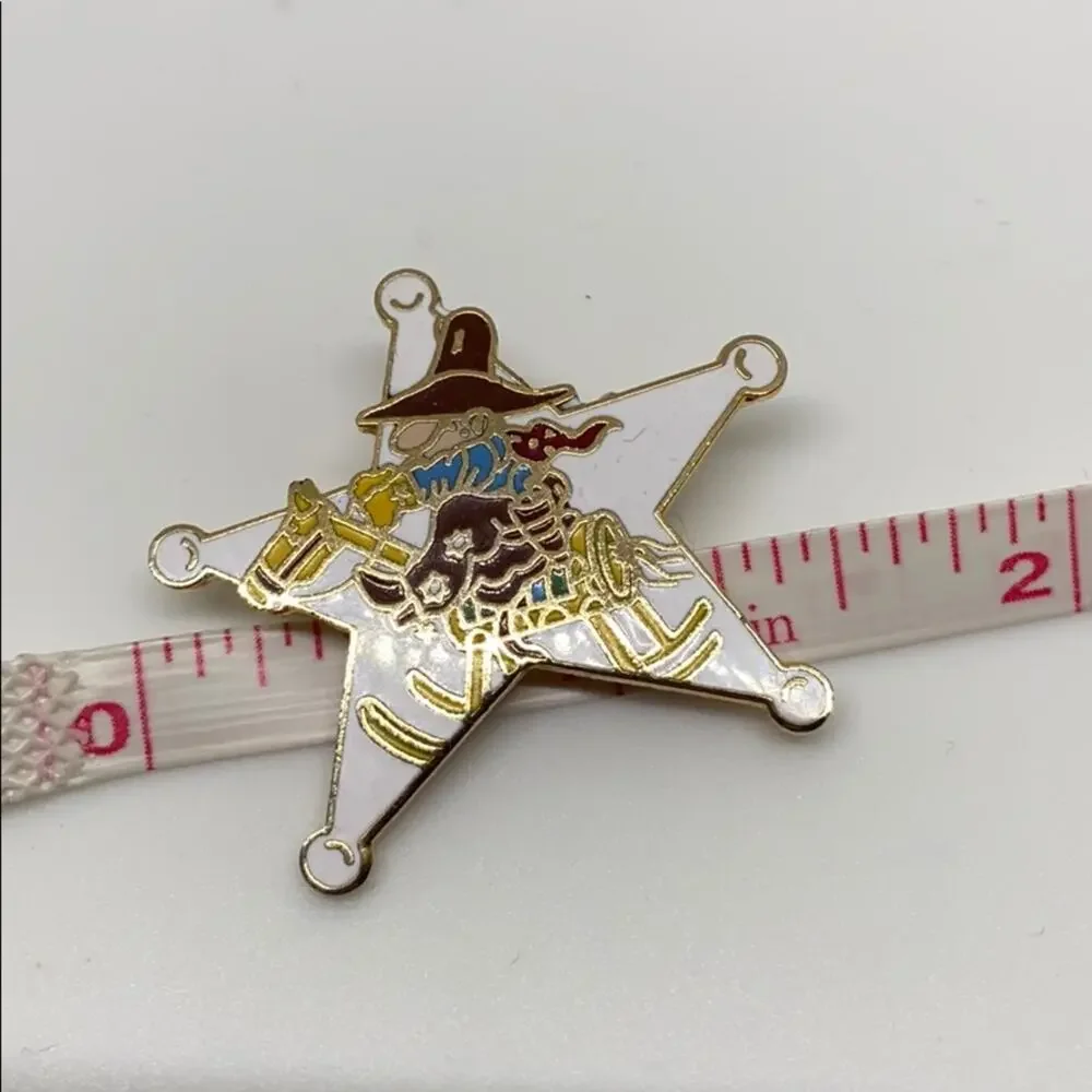 A cowboy on a Rockinghorse sheriff star pin